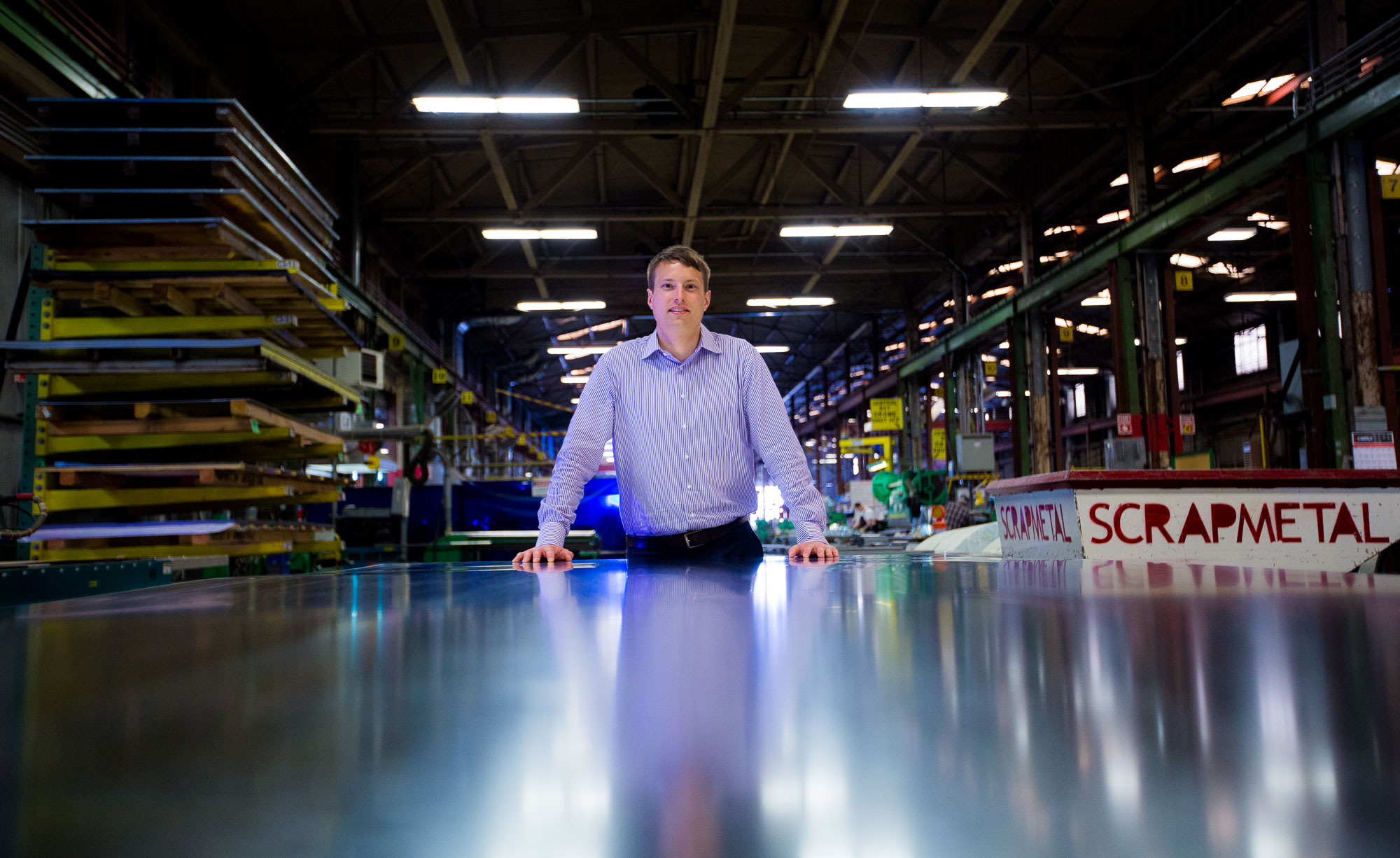 Editorial portrait shoot MBA graduate on site at his construction fabrication facility in Seattle